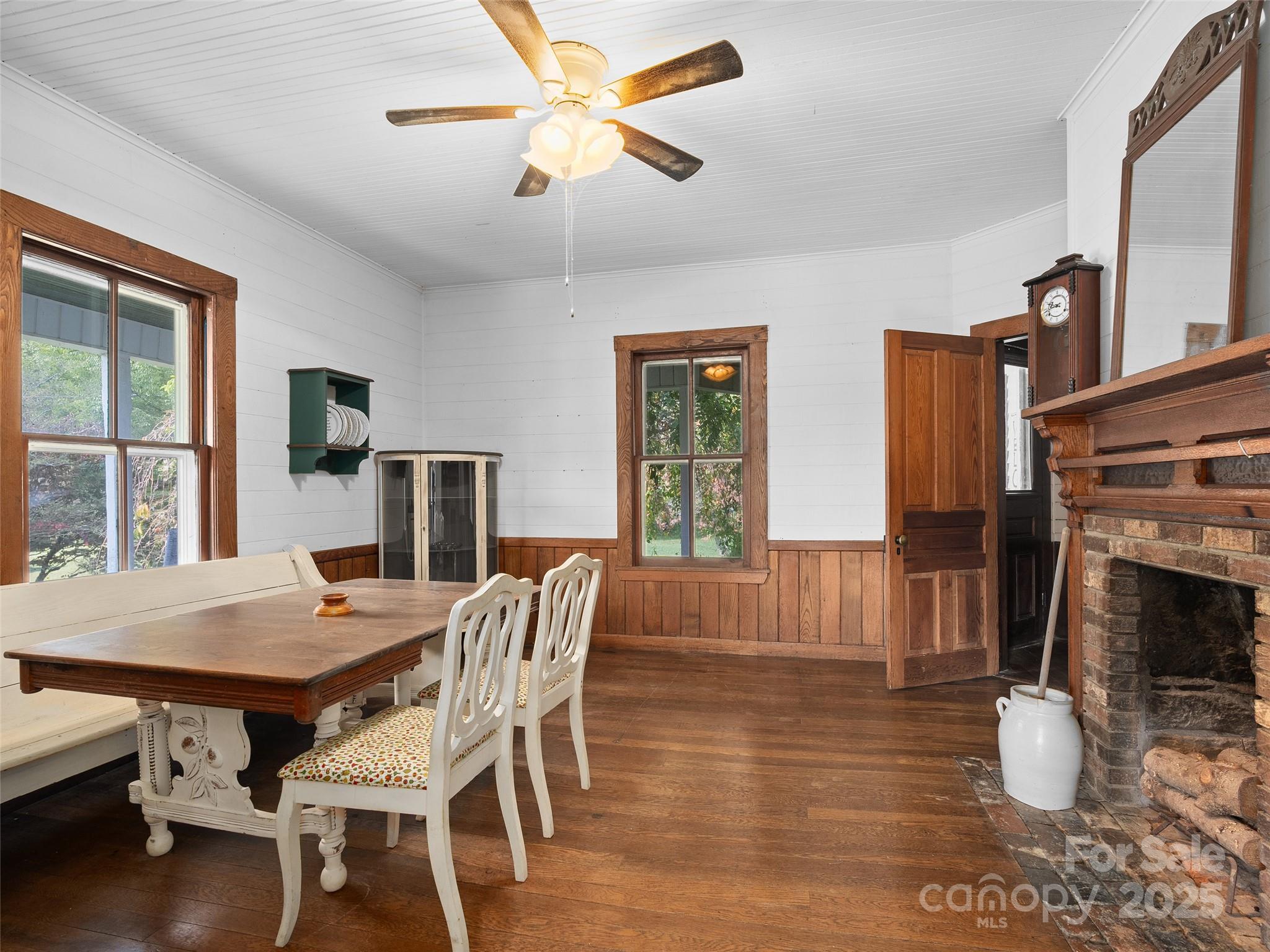 4912 Pigeon Road Waynesville, NC 28786 - Photo 10 of 38 a view of a dining room with furniture window and wooden floor