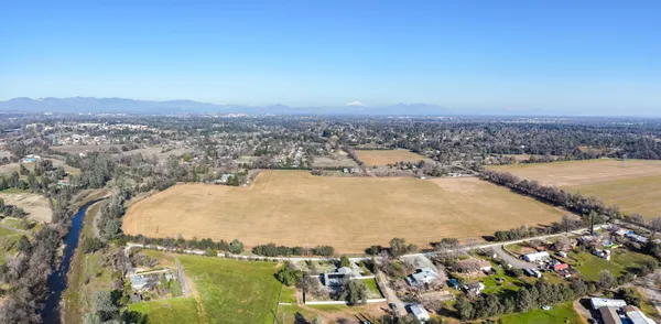 an aerial view of residential building and ocean view