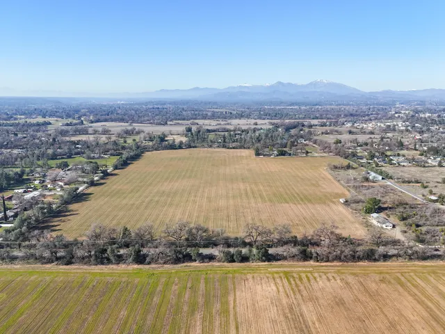 an aerial view of residential house and car parked