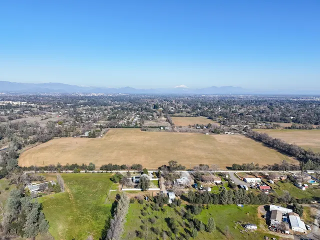 an aerial view of residential building and ocean