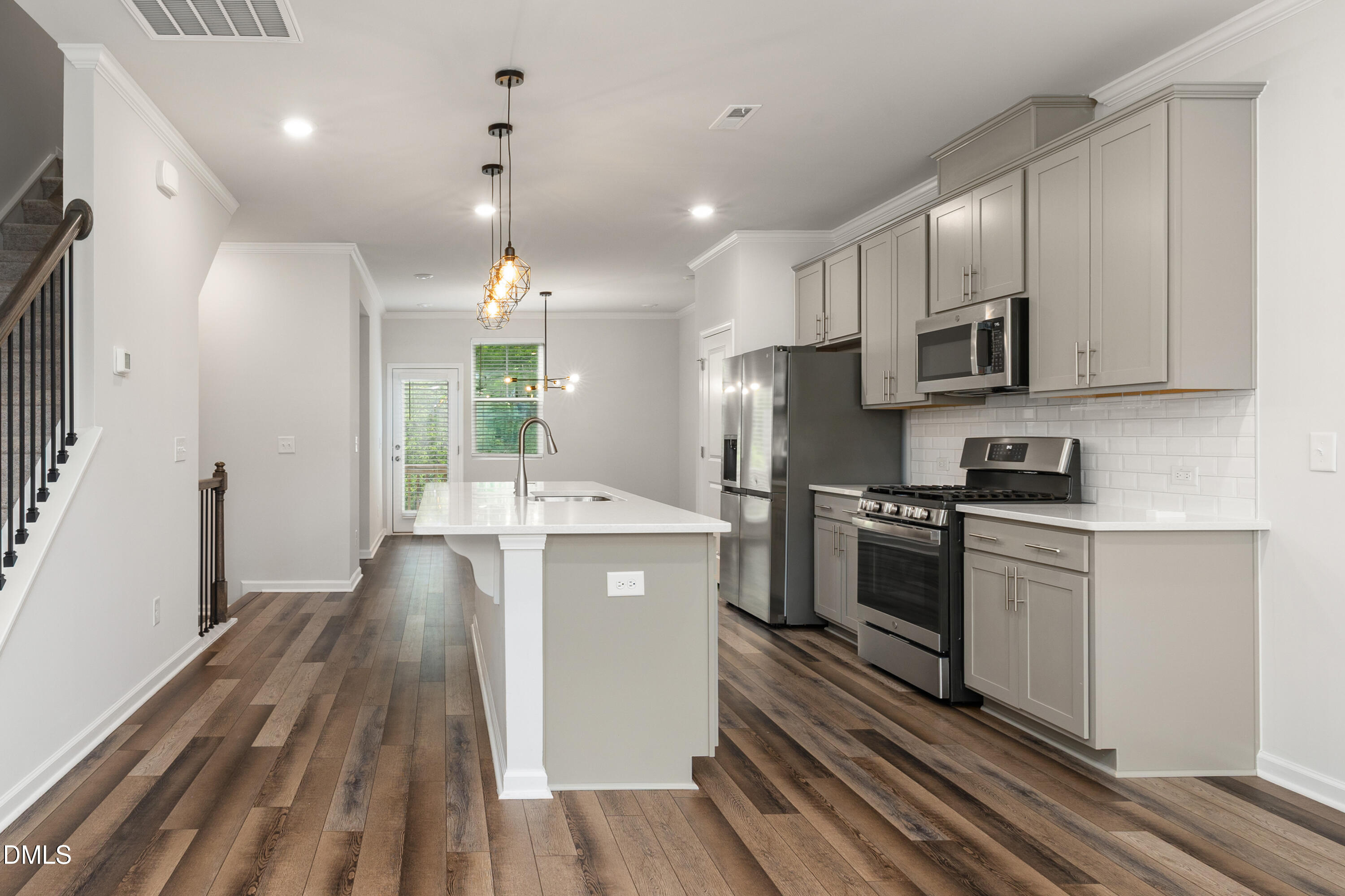 2524 Laurel Valley Way Raleigh, NC 27604 - Photo 12 of 12 a kitchen with stainless steel appliances granite countertop a stove a sink and a refrigerator