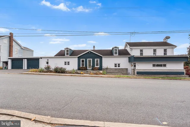 a aerial view of a house with swimming pool