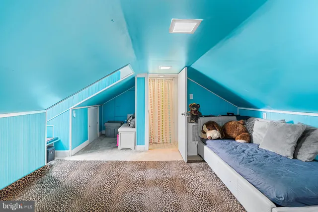 a bed room with a bed and a couch