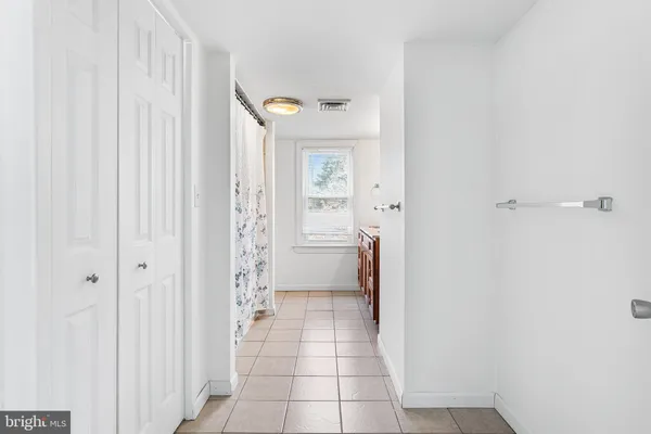 a bathroom with a shower and a sink