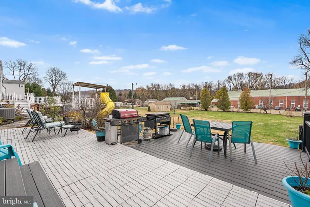 a view of a terrace with furniture and garden