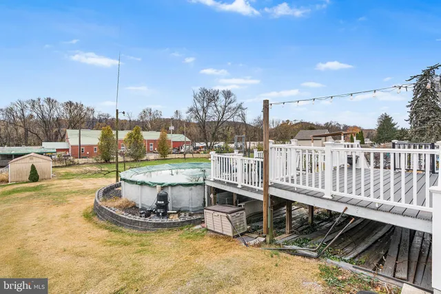 a view of a swimming pool with a chairs