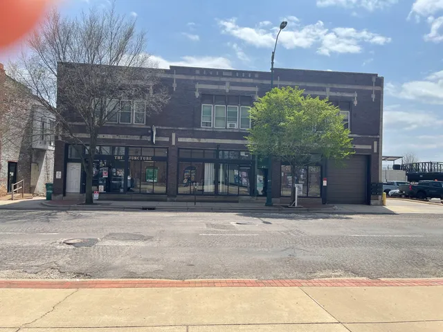 a front view of a building with garden