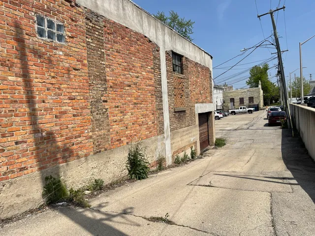 a view of a backyard with sitting area