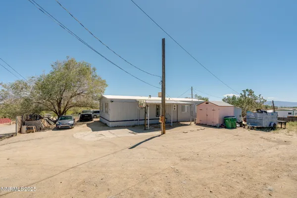 a view of a house with a snow in the yard