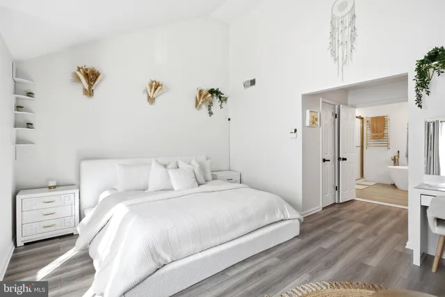 a bedroom with a bed and a couch