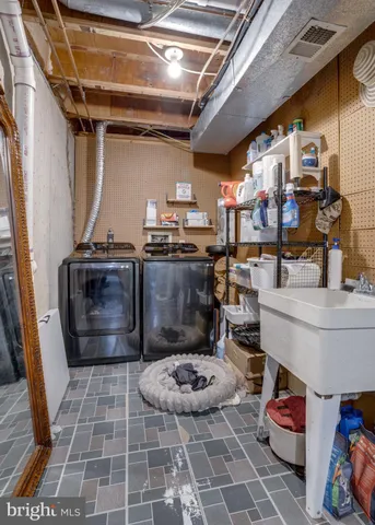 a storage room with water heater and racks