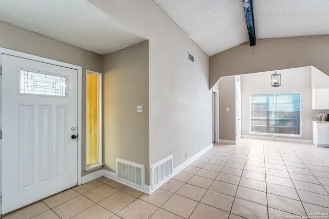 a view of an empty room and window