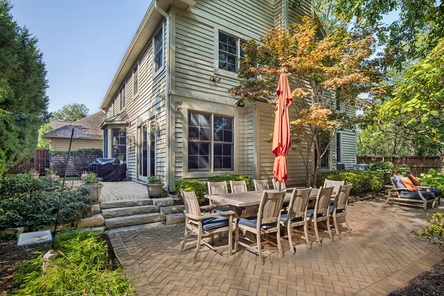 a view of a patio with table and chairs and potted plants