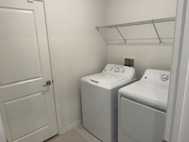 6259 Back Forty Loop Zephyrhills, FL 33541 - Photo 8 of 22 a utility room with dryer and washer