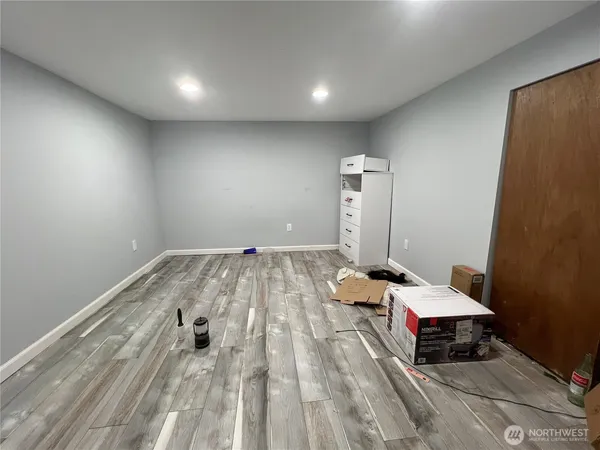 a view of balcony with wooden floor and fence