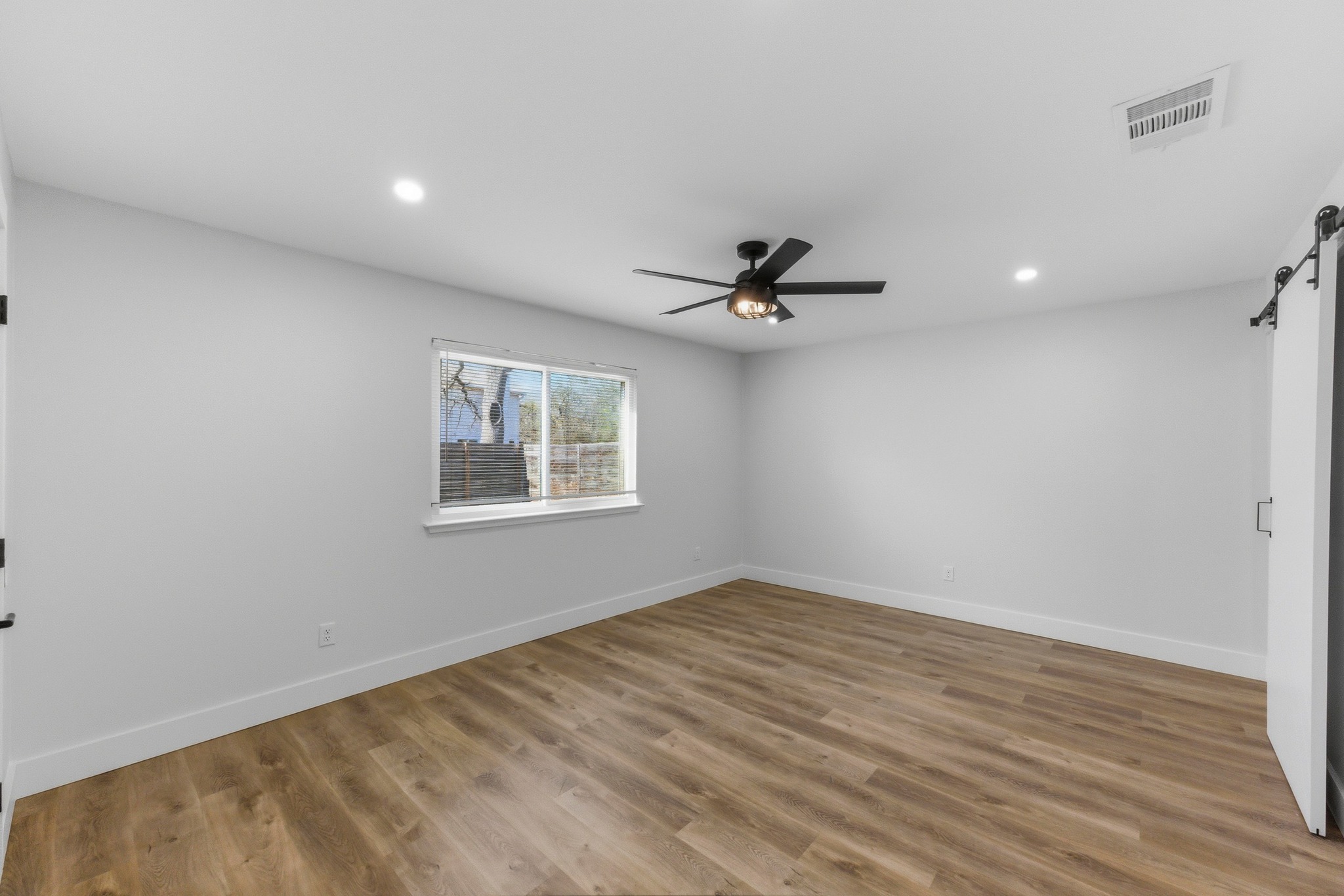 3817 Leafield Drive Austin, TX 78749 - Photo 17 of 31 a view of empty room with wooden floor and fan