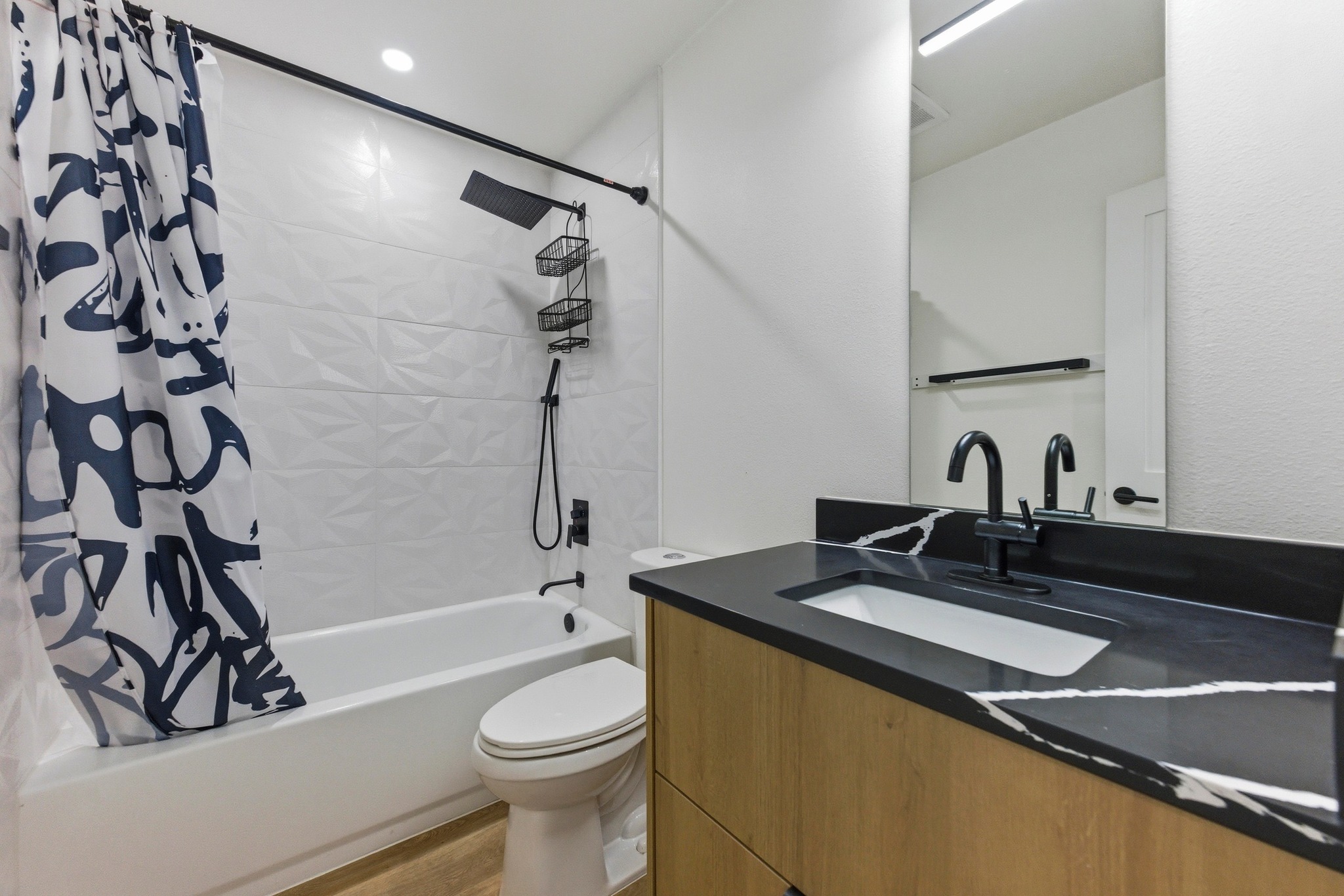 3817 Leafield Drive Austin, TX 78749 - Photo 23 of 31 a bathroom with a sink a toilet and a bathtub