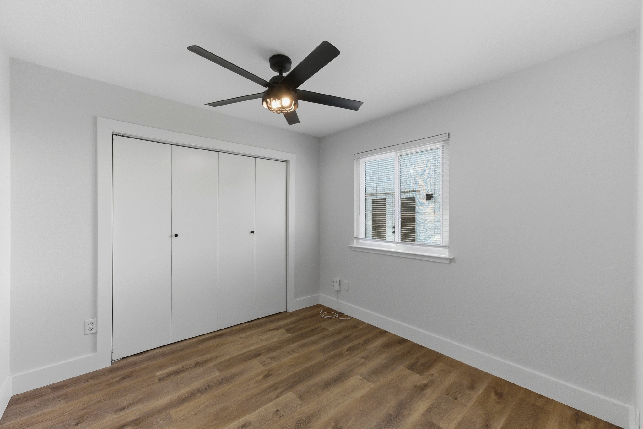 3817 Leafield Drive Austin, TX 78749 - Photo 25 of 31 a view of a big room with wooden floor closet and windows