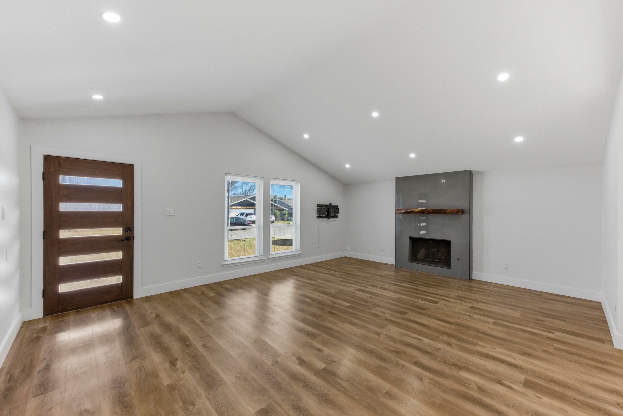 3817 Leafield Drive Austin, TX 78749 - Photo 4 of 31 a view of an empty room with a fireplace and a window
