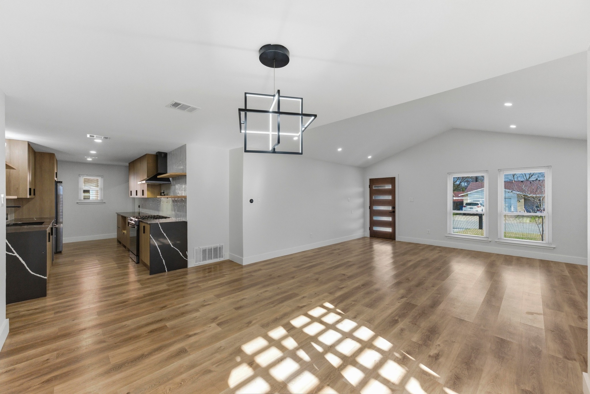 3817 Leafield Drive Austin, TX 78749 - Photo 10 of 31 a view of a kitchen with a sink and a refrigerator