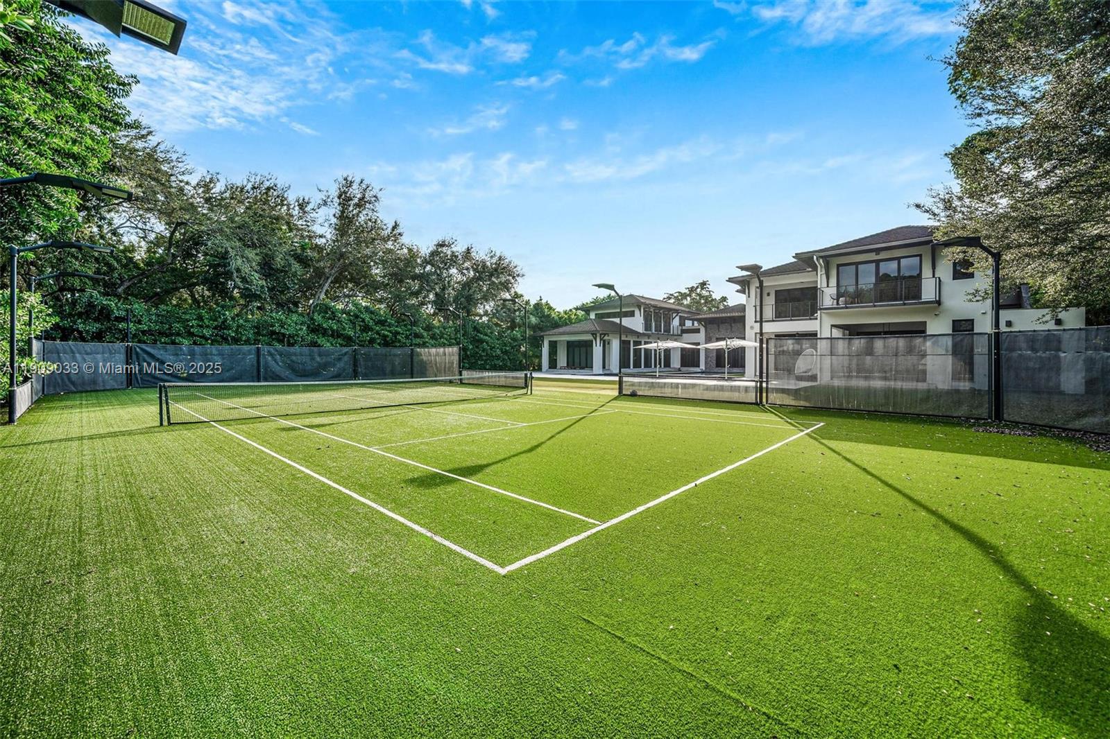 8961 Southwest 62nd Court Pinecrest, FL 33156 - Photo 22 of 72 a view of a tennis court
