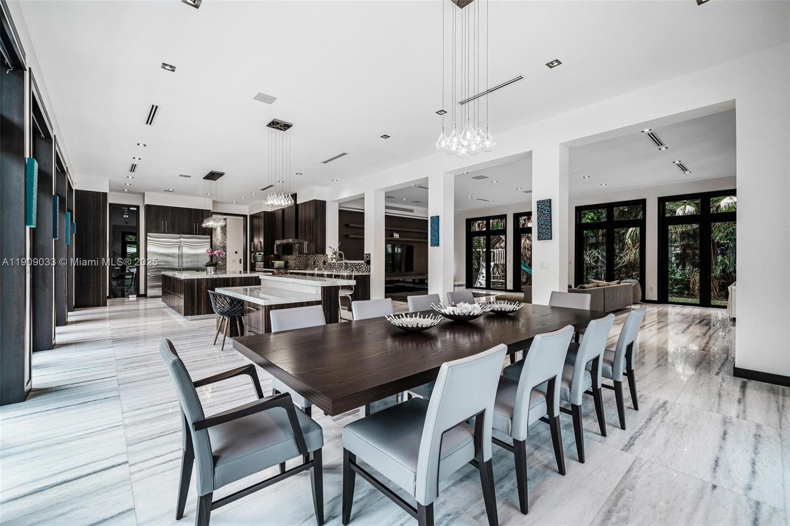 8961 Southwest 62nd Court Pinecrest, FL 33156 - Photo 31 of 72 a view of a dining area with furniture and wooden floor