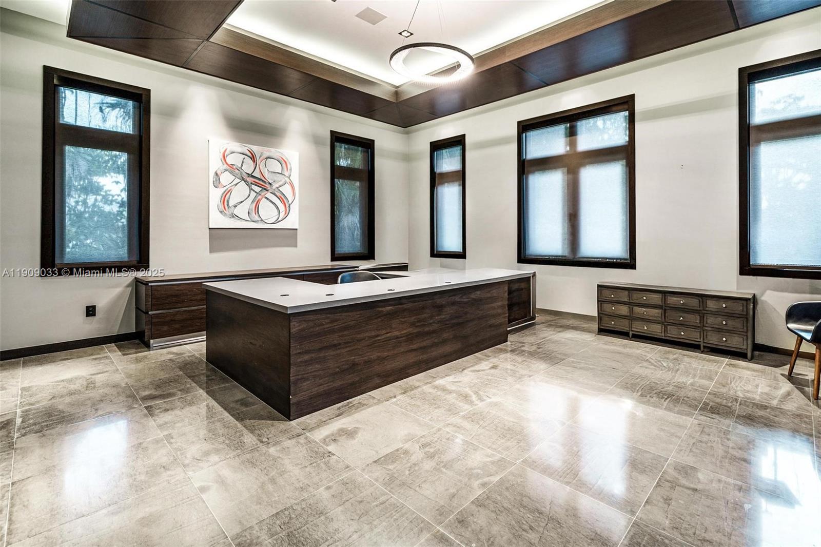8961 Southwest 62nd Court Pinecrest, FL 33156 - Photo 33 of 72 a living room with stainless steel appliances kitchen island granite countertop furniture and a large window