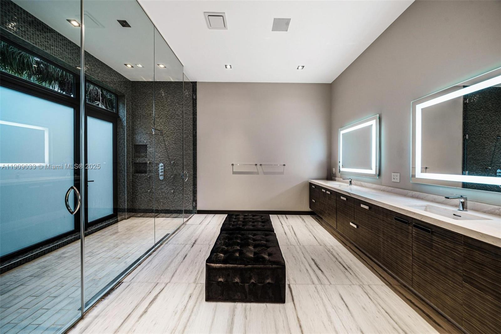 8961 Southwest 62nd Court Pinecrest, FL 33156 - Photo 38 of 72 a large kitchen with a large counter top space a sink and stainless steel appliances