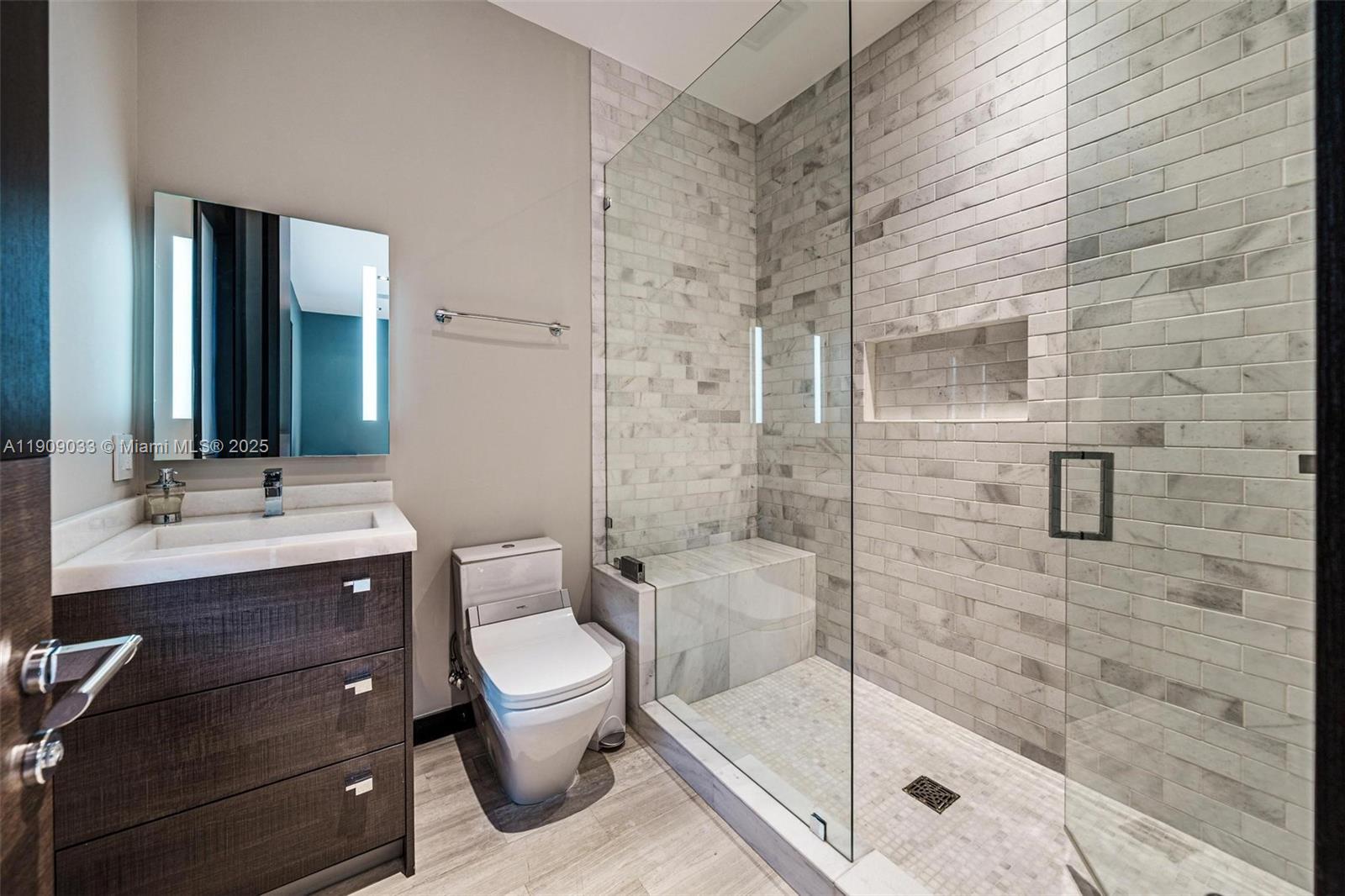 8961 Southwest 62nd Court Pinecrest, FL 33156 - Photo 44 of 72 a bathroom with a sink a toilet and shower