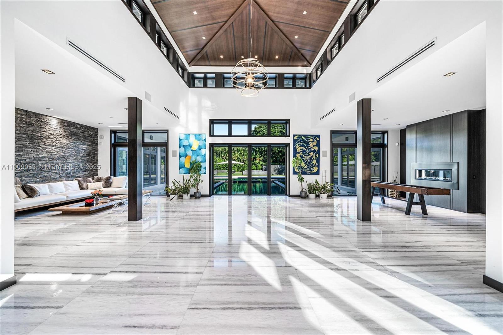 8961 Southwest 62nd Court Pinecrest, FL 33156 - Photo 6 of 72 a view of lobby with furniture and floor to ceiling window