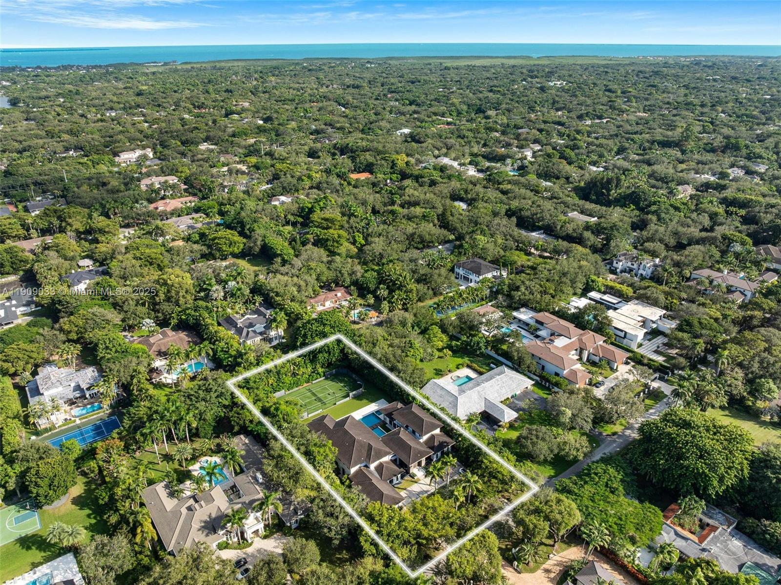 8961 Southwest 62nd Court Pinecrest, FL 33156 - Photo 65 of 72 an aerial view of residential houses with outdoor space and trees