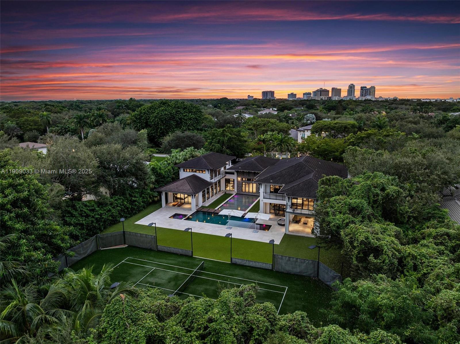 8961 Southwest 62nd Court Pinecrest, FL 33156 - Photo 69 of 72 a view of a house with a big yard