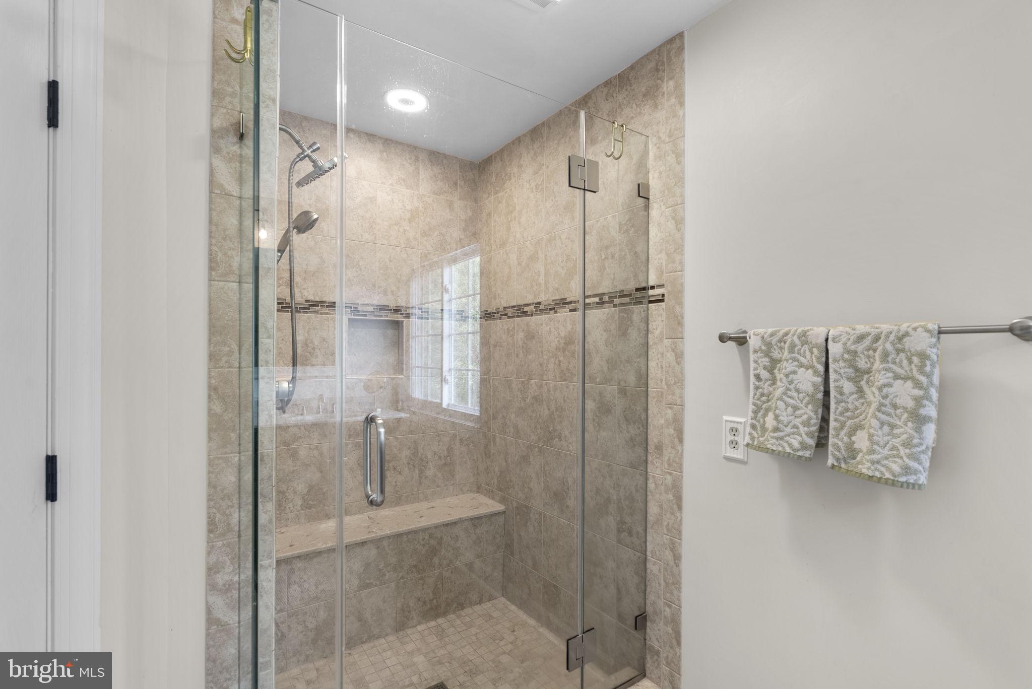 2730 Howard Grove Road Davidsonville, MD 21035 - Photo 31 of 68 Sleek glass shower with modern tiles.