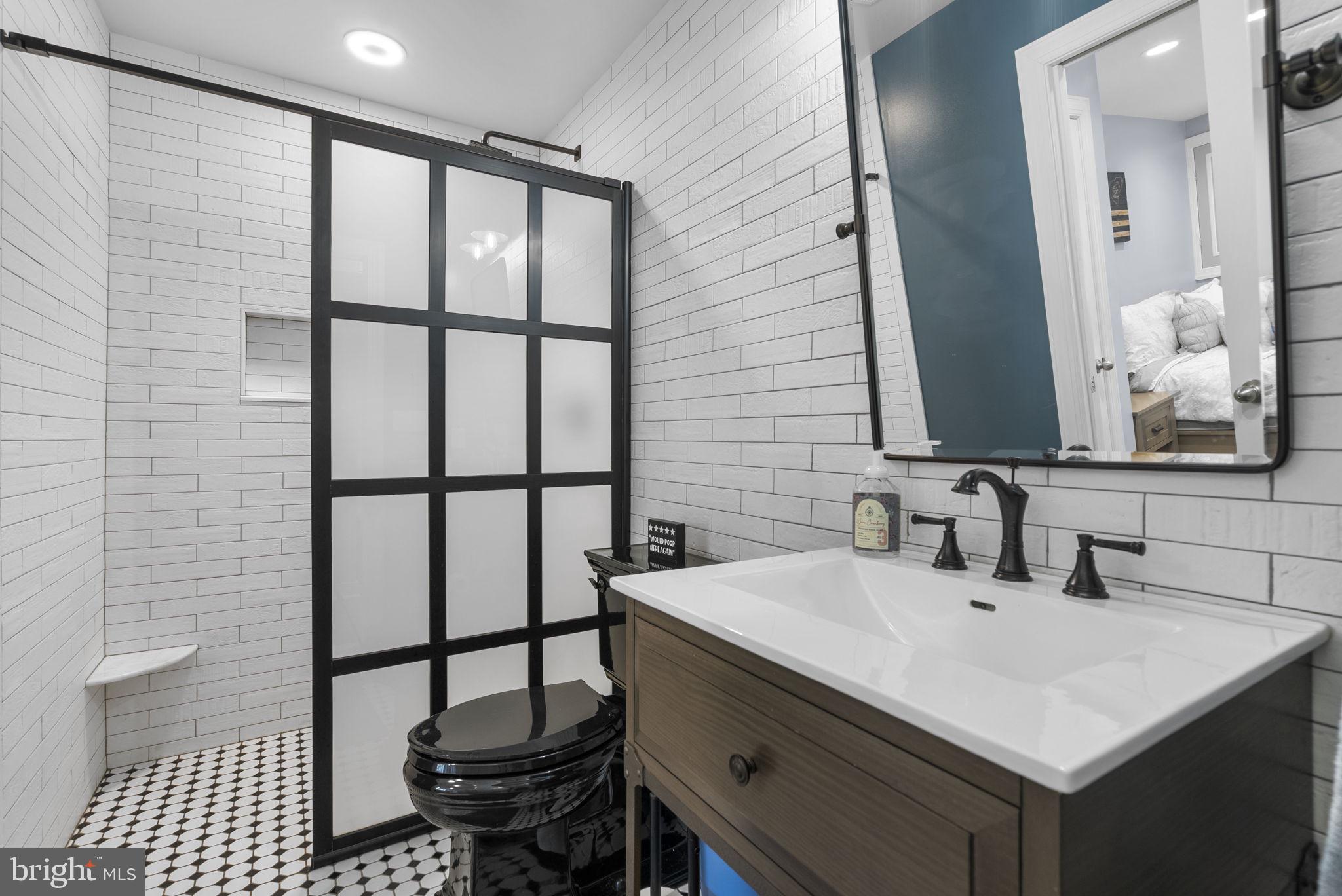 2730 Howard Grove Road Davidsonville, MD 21035 - Photo 47 of 68 Sleek modern bathroom with stylish tiles.