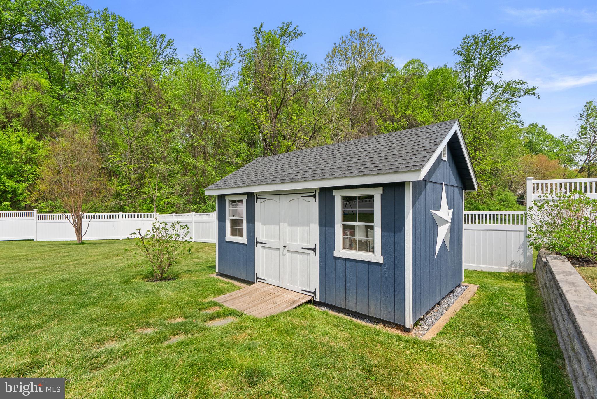 2730 Howard Grove Road Davidsonville, MD 21035 - Photo 56 of 68 Charming garden shed with star detail.
