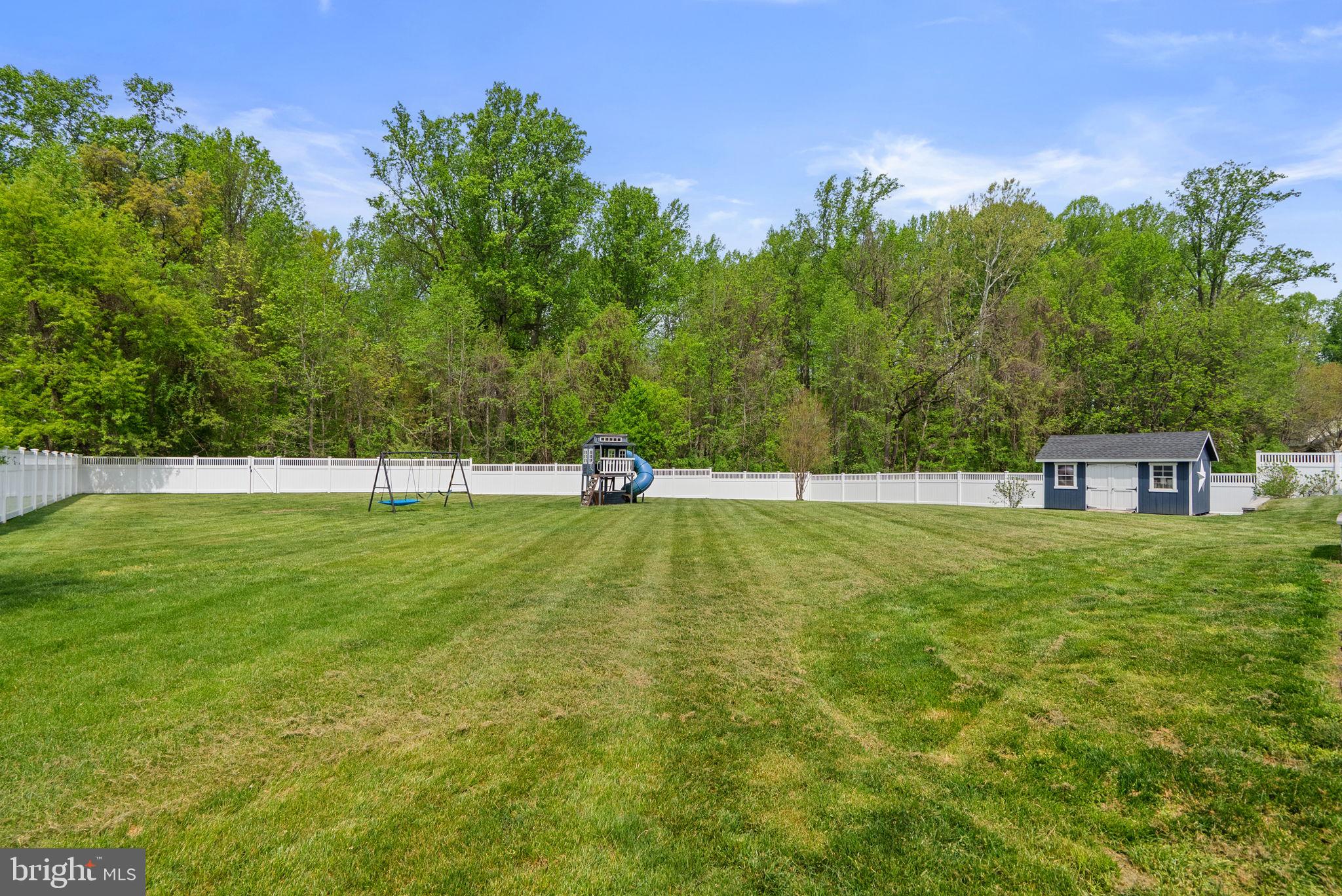 2730 Howard Grove Road Davidsonville, MD 21035 - Photo 57 of 68 Spacious yard with lush greenery.