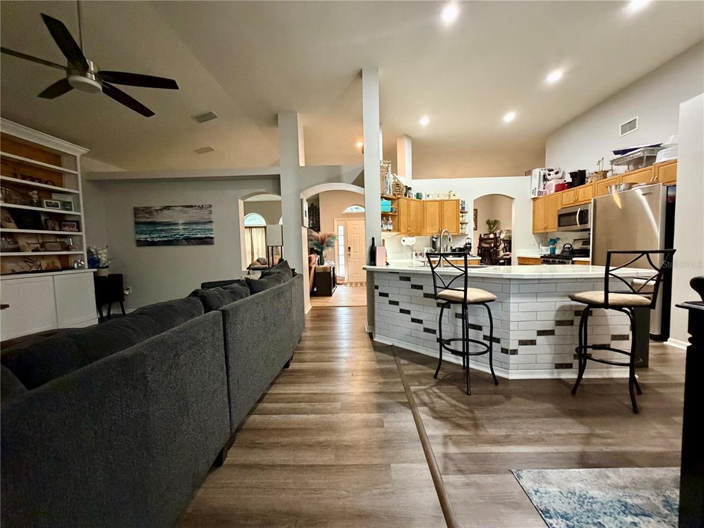 4303 Orange Ridge Court Valrico, FL 33596 - Photo 21 of 40 a living room with lots of furniture and kitchen view