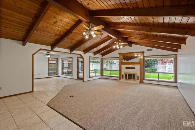 a view of an empty room with windows