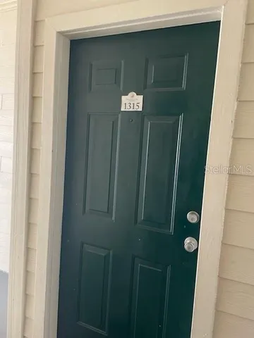a bathroom with a glass door shower and vanity