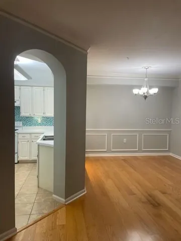 a view of a hallway with a kitchen