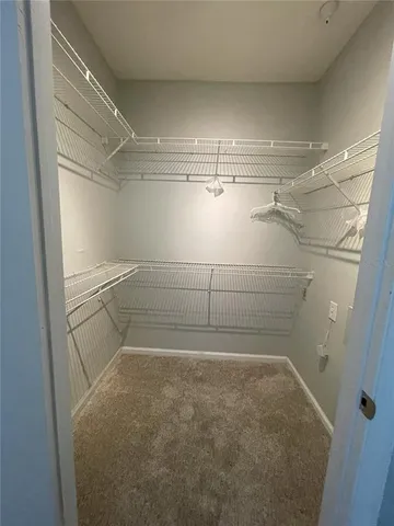 a view of a room with racks on the wall