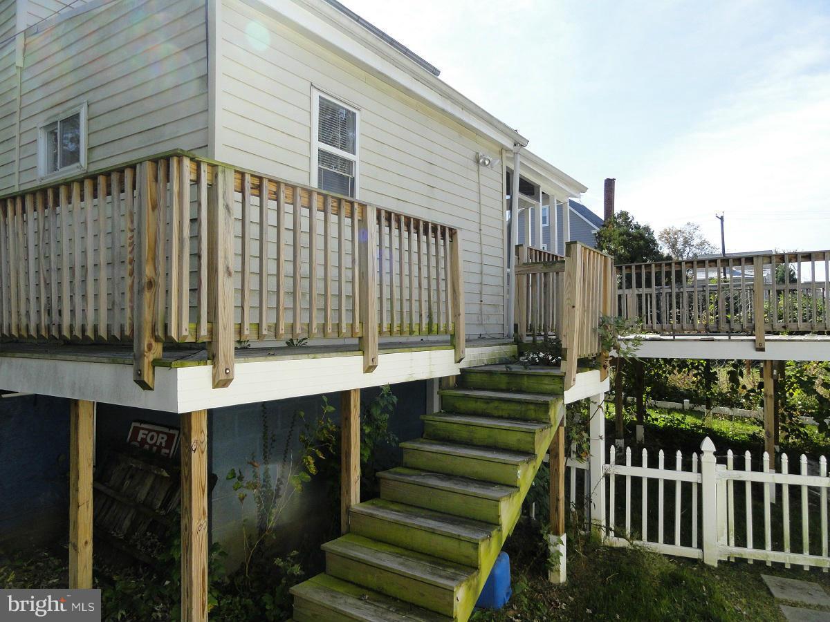 5504 Morello Road Baltimore, MD 21214 - Photo 21 of 24 View of Deck from Fenced Rear Yard