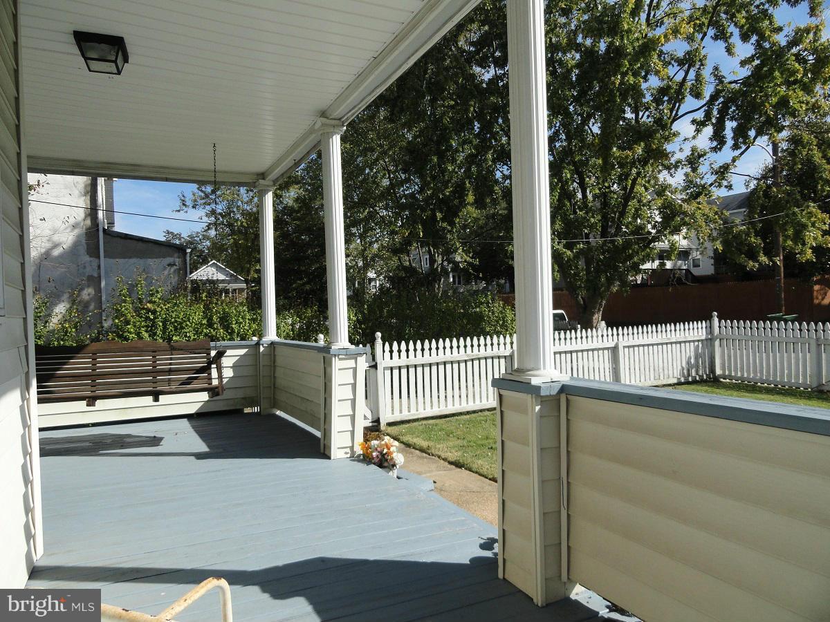 5504 Morello Road Baltimore, MD 21214 - Photo 23 of 24 25 x 10 Covered Front Porch w/ Swing