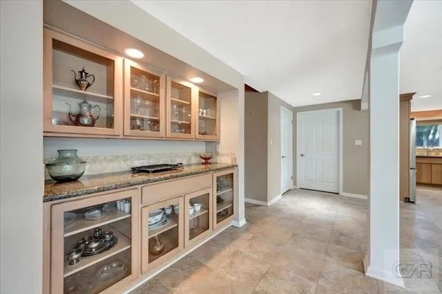 a kitchen with stainless steel appliances granite countertop a stove and a refrigerator