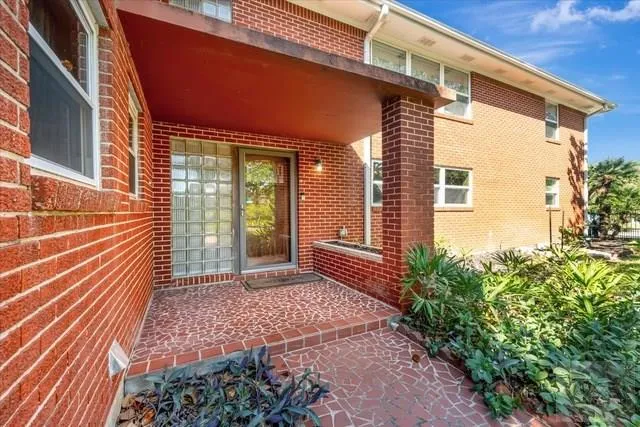 a view of a house with a door and wooden floor