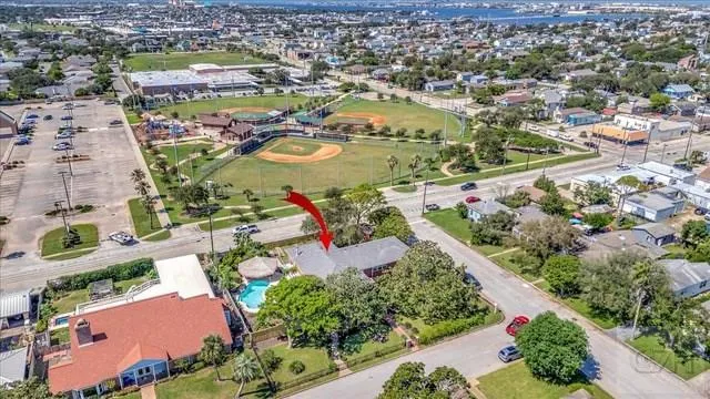 an aerial view of residential houses with outdoor space