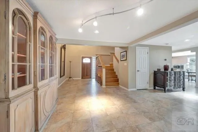 a view of a hallway with seating area