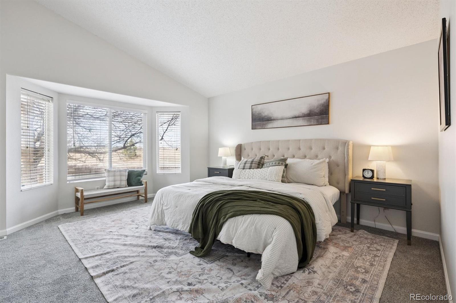 5241 Helena Street Denver, CO 80239 - Photo 11 of 28 a bedroom with a bed and a couch