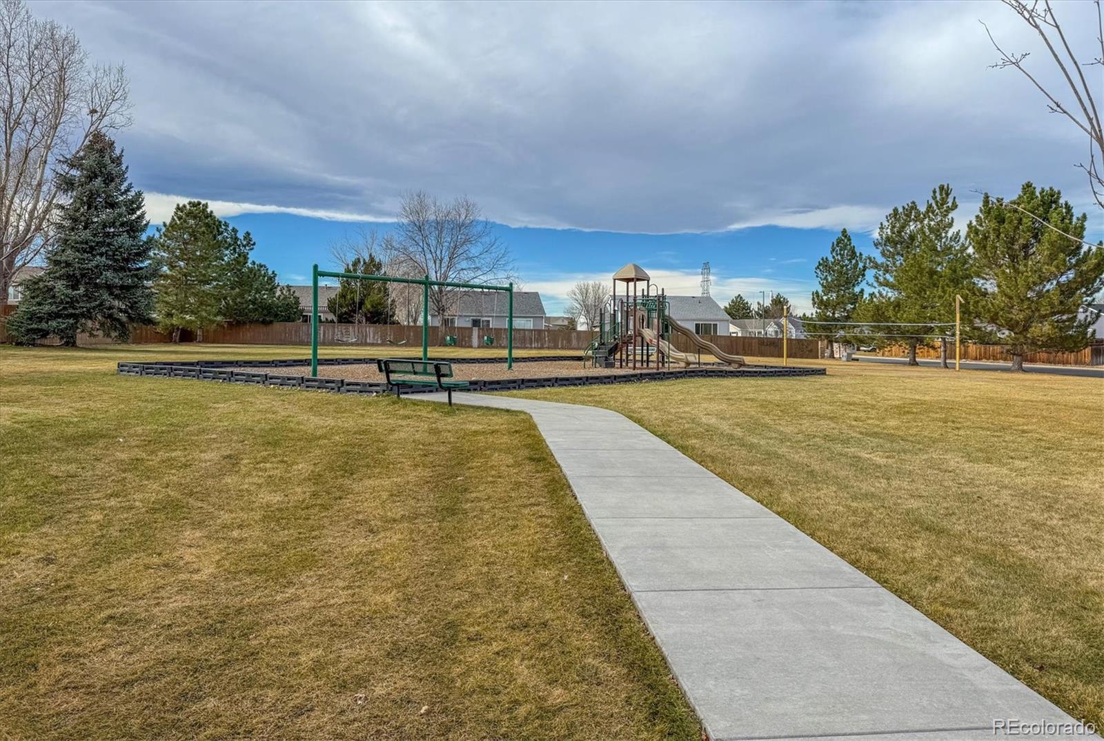 5241 Helena Street Denver, CO 80239 - Photo 25 of 28 a swimming pool with outdoor seating and yard