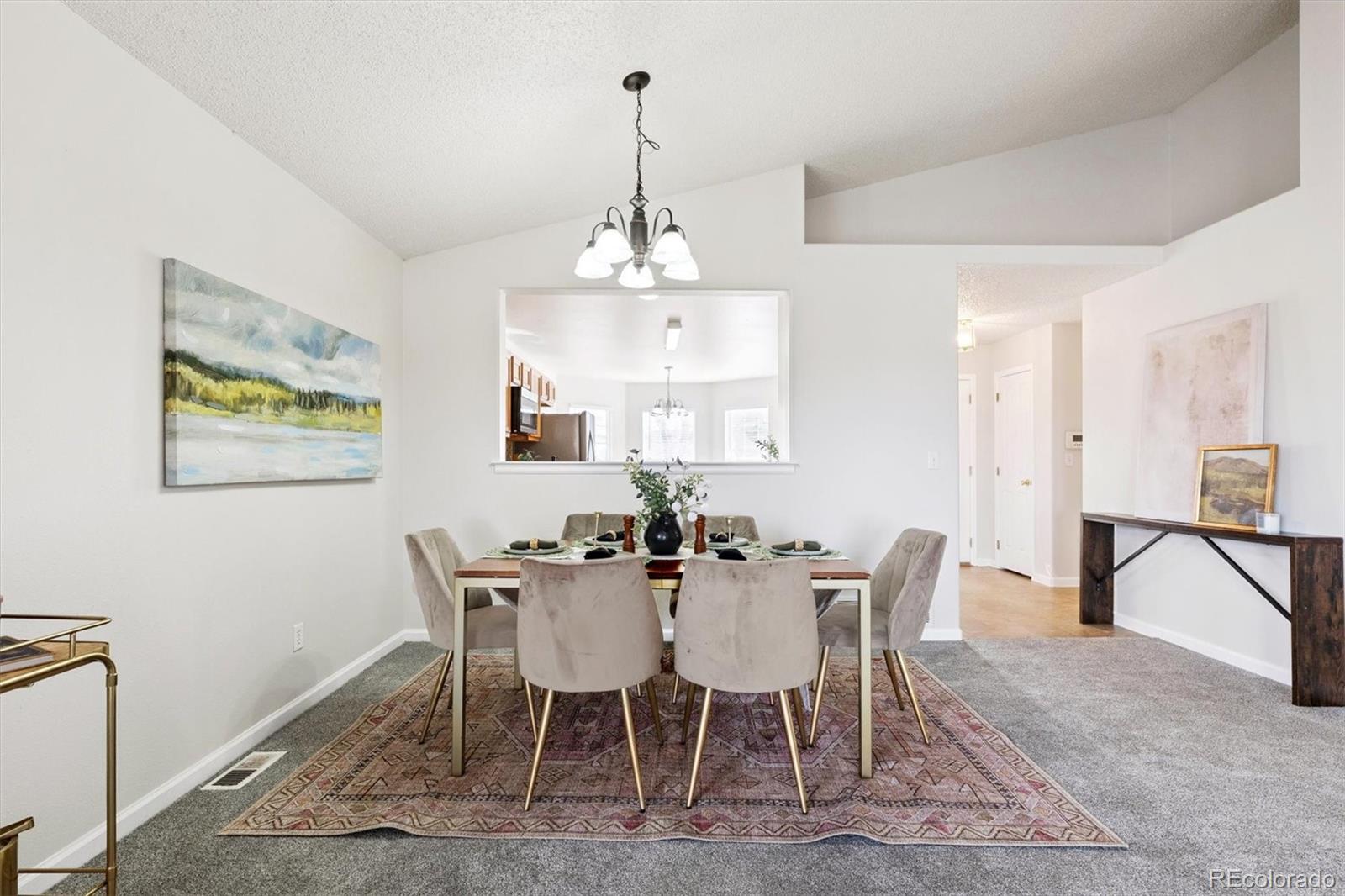 5241 Helena Street Denver, CO 80239 - Photo 5 of 28 a view of a dining room with furniture